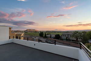 Balcony at dusk with a mountain view