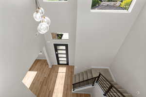 Foyer with a high ceiling and light hardwood / wood-style floors