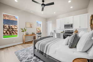 Bedroom featuring ceiling fan and light wood-type flooring