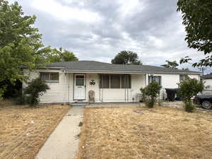 Single story home featuring a porch