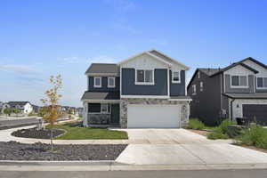 View of front facade featuring a garage