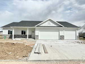 View of front of property featuring a garage