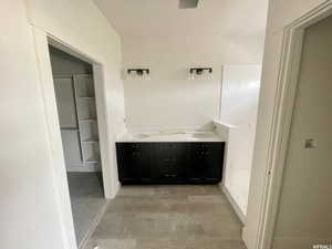 Bathroom with wood-type flooring and double sink vanity