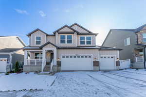 View of front facade featuring a garage