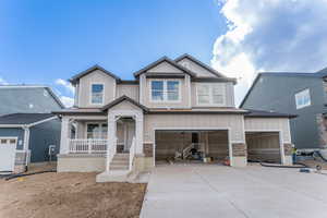 Craftsman-style house featuring covered porch