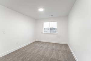 Empty room featuring carpet floors