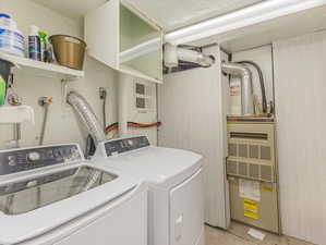 Clothes washing area with washer and clothes dryer