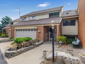 View of property with a garage