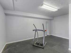 Workout area with a textured ceiling