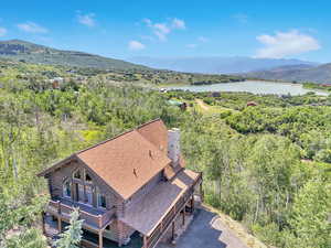 Drone / aerial view with a water and mountain view