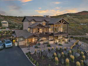 View of front of home featuring a mountain view and a garage