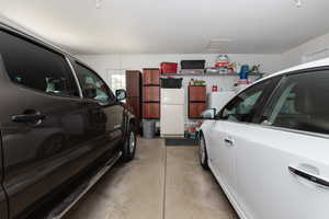 Garage featuring white fridge