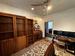 Office space with ceiling fan and light hardwood / wood-style floors