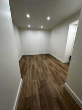 Unfurnished room with hardwood / wood-style flooring