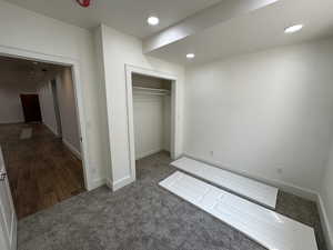 Unfurnished bedroom featuring a closet and hardwood / wood-style floors