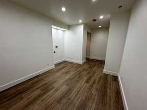 Empty room featuring wood-type flooring