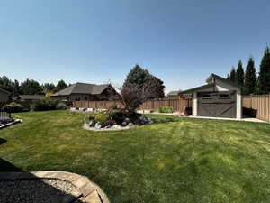 View of yard with a storage shed