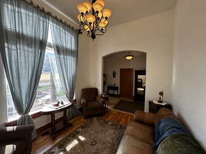 Living room featuring hardwood / wood-style flooring and a chandelier