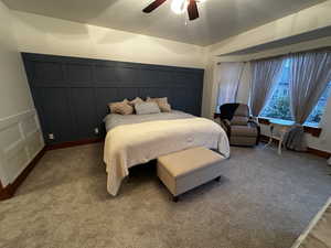 Bedroom featuring ceiling fan and carpet flooring