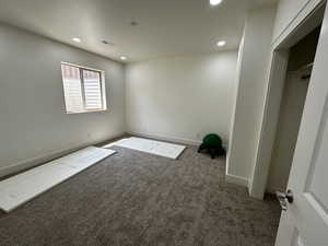 Unfurnished room with carpet