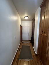 Doorway with hardwood / wood-style flooring