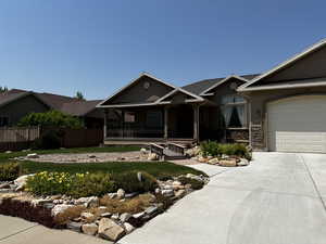 View of front of house with a porch and a garage