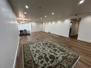 Living room featuring a chandelier and hardwood / wood-style flooring