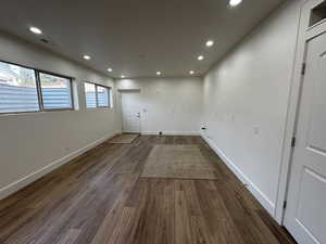 Unfurnished room featuring dark wood-type flooring