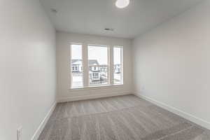 Empty room with carpet floors