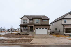 View of front of property featuring a garage