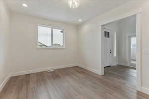 Empty room with wood-type flooring