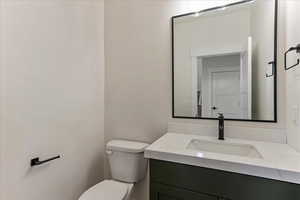 Bathroom with vanity and toilet