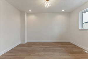 Unfurnished room featuring light hardwood / wood-style floors