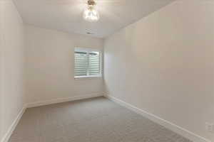 Unfurnished room with carpet floors