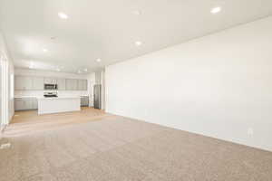 Unfurnished living room featuring light wood-type flooring