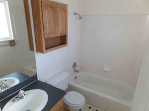 Full bathroom with tile patterned flooring, toilet, shower / washtub combination, and vanity