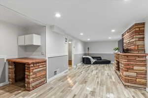 living area with desk and fireplace