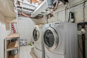 Washroom with washing machine and dryer