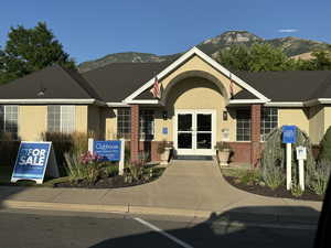 View of front facade with a mountain view and french doors