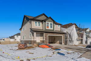 View of front of property featuring a garage