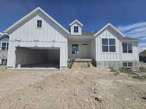 View of front of property featuring a garage