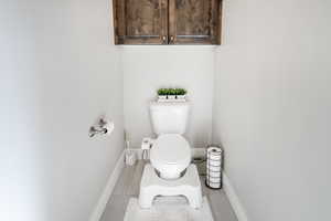 Bathroom with tile patterned flooring and toilet