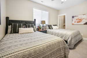 Bedroom featuring carpet flooring and ceiling fan