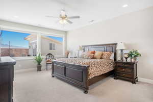 Bedroom with light carpet and ceiling fan