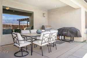 View of patio / terrace with a mountain view and grilling area