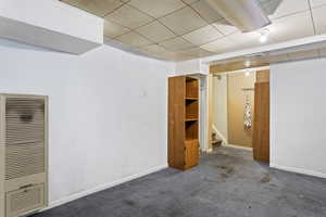 Basement with carpet flooring