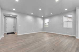 Empty room featuring light hardwood / wood-style flooring and a textured ceiling