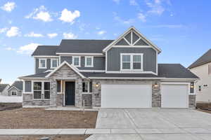 View of front of property featuring a garage