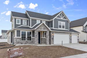 View of front facade featuring a garage