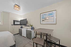 Bedroom with light hardwood / wood-style flooring